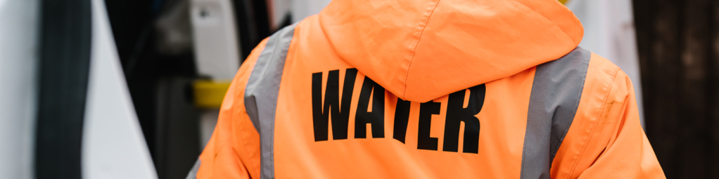Essex & Suffolk worker in orange jacket