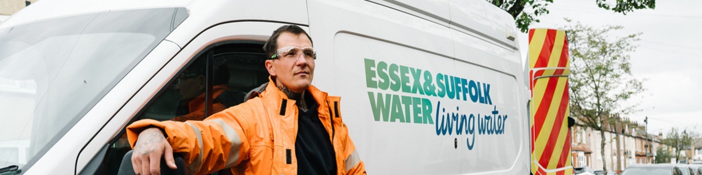 ESW Employee Standing Next to Van